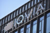 IQVIA signage, logo on the facade of American multinational company serving the combined industries of health information technology and clinical research. WARSAW, POLAND – JANUARY 9, 2022
